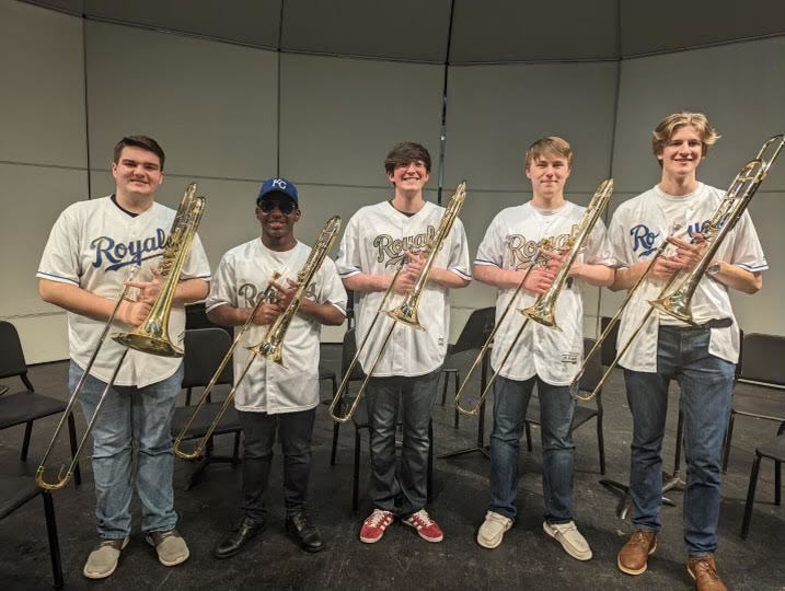 Five trombone players: Bo Helzer, Omari Mourning, Brady Dillon, Riley Zimmerman, and Ben Robinson