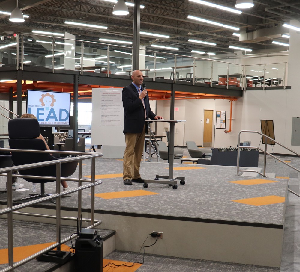 Abe Lewis speaks to visitors