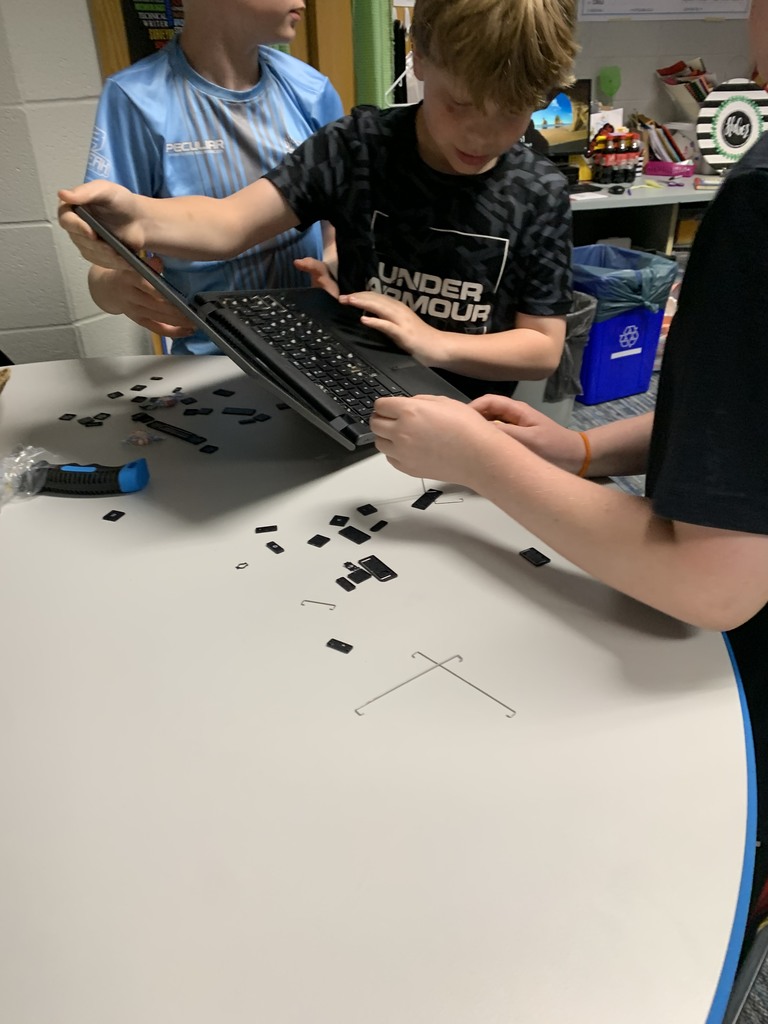 LEAP students taking apart computers