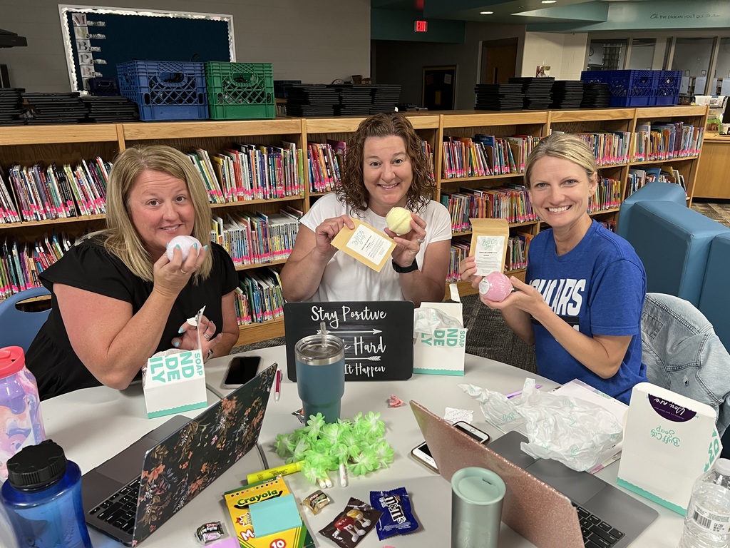 Three teachers holding Buff City products