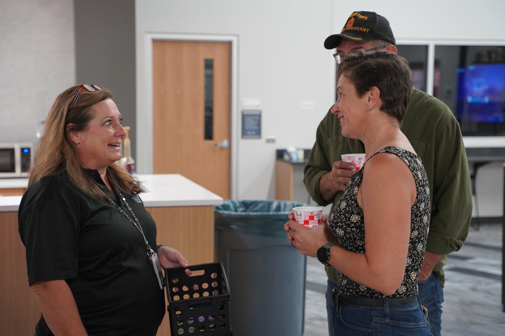 Peculiar Chamber of Commerce members talk in a small group