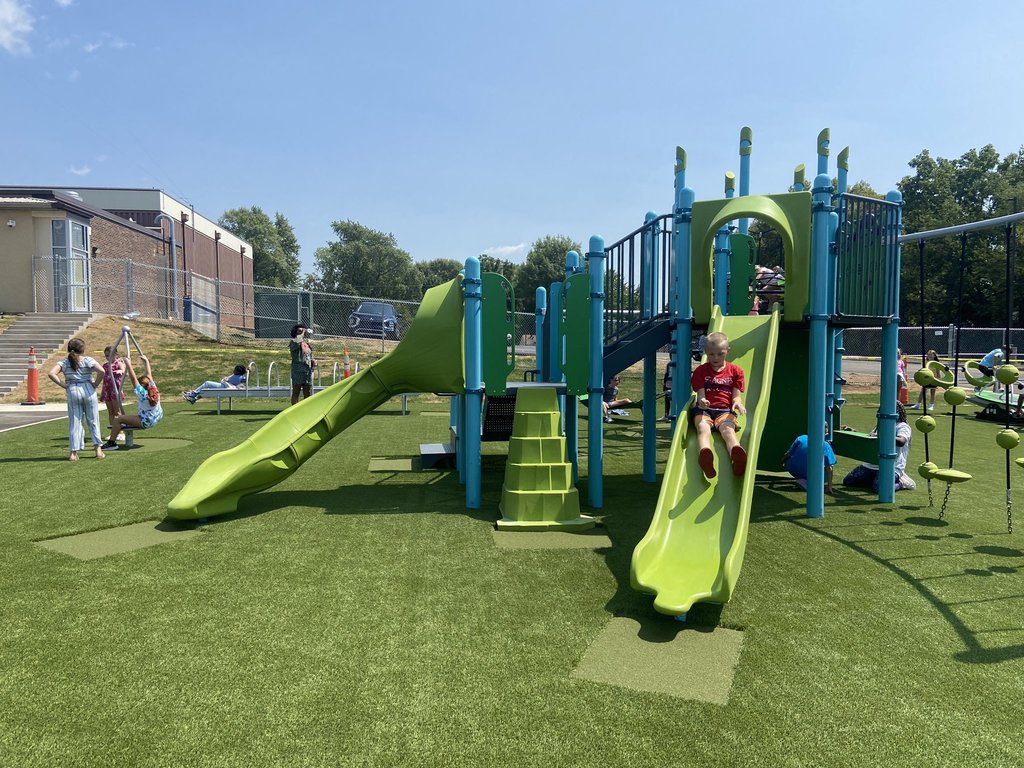 Raymore Elementary School students playing on the new playground