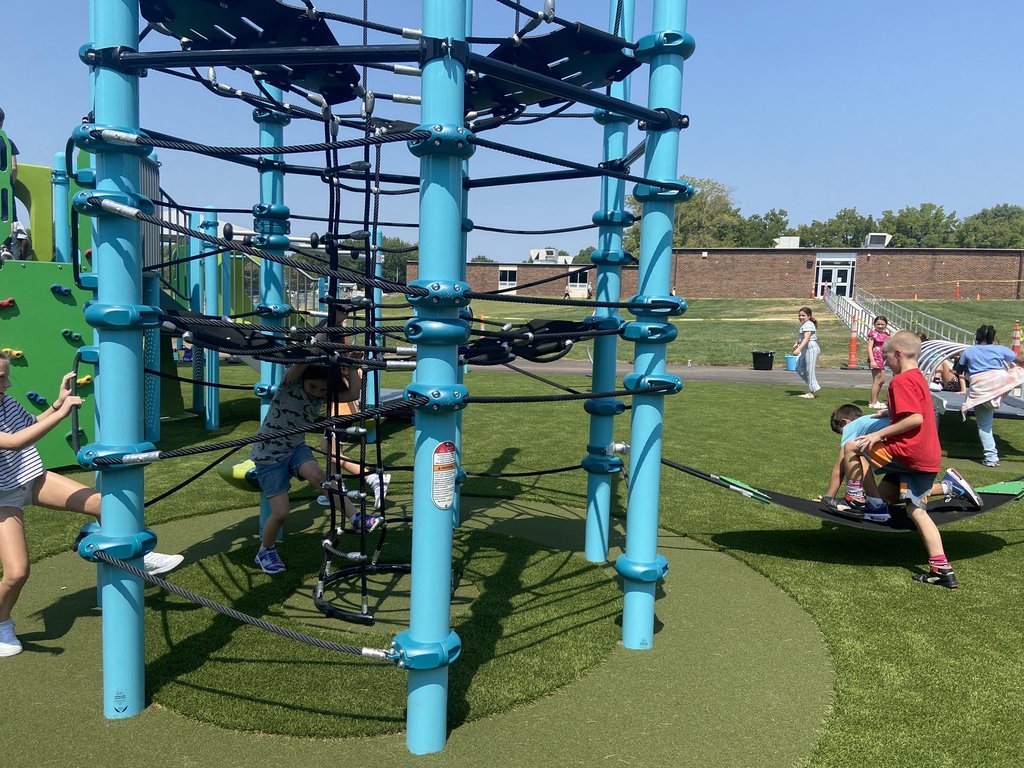 Raymore Elementary School students playing on the new playground